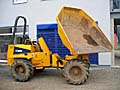 Auf dem Bild ist ein gelber Raddumper abgebildet. Auf dem Bild ist ein gelber Raddumper abgebildet.